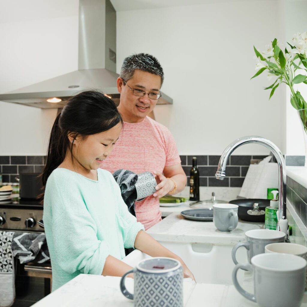 Father and daughter in kitchen