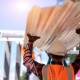 Commercial roofing contractor carrying metal roofing