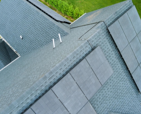 Light colored roof shingles with solar panels