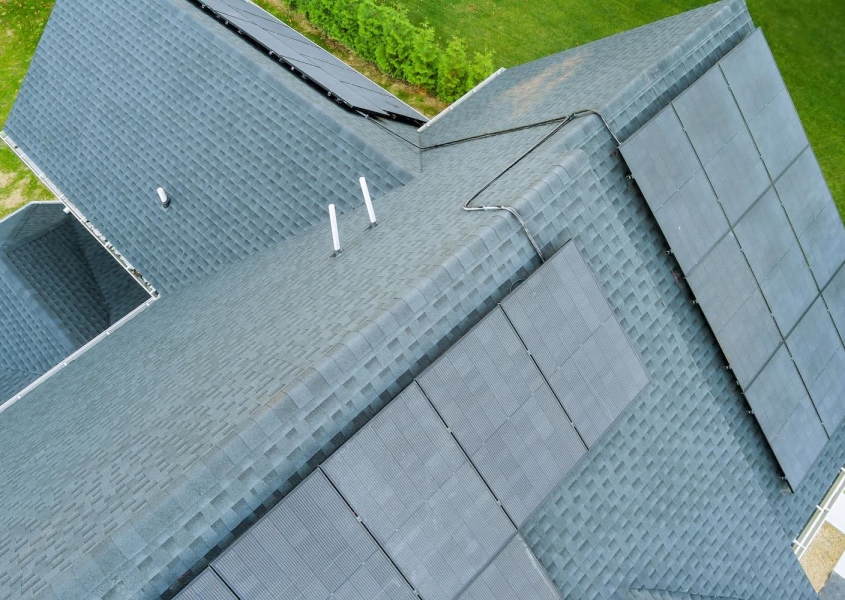 Light colored roof shingles with solar panels