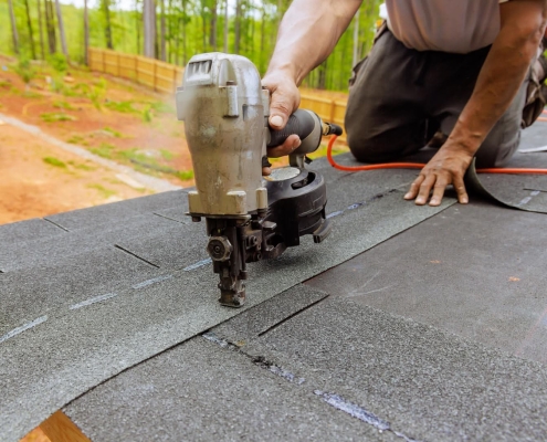 Roofer installing a new roof