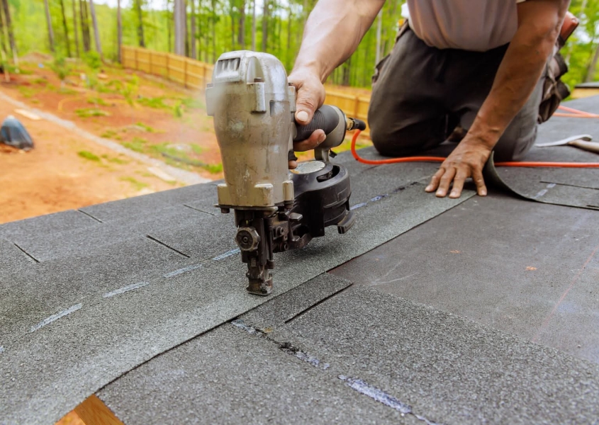 Roofer installing a new roof