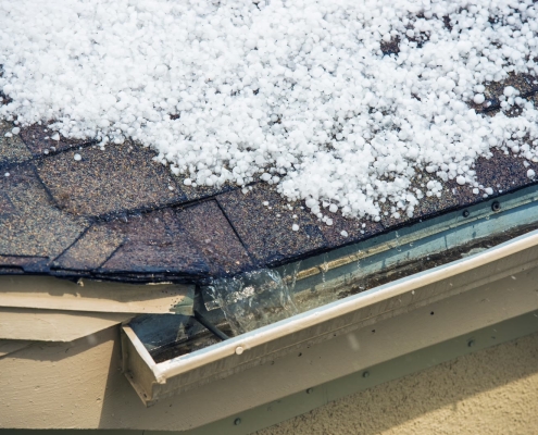 Damaged roof covered in hail