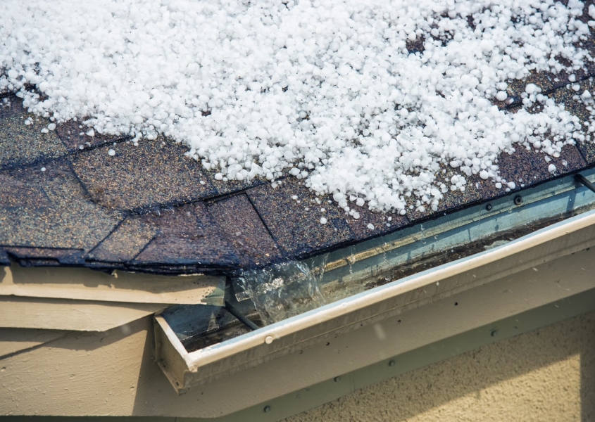 Damaged roof covered in hail