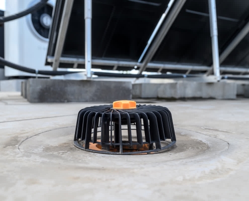 Clean drain on a flat commercial roof.