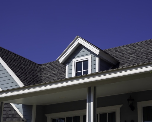 Homeowner reviewing roof financing options with a contractor