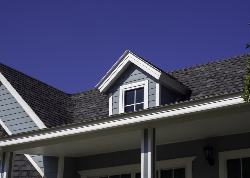 Homeowner reviewing roof financing options with a contractor
