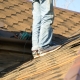 Emergency same-day roof repair being performed on leaking residential home