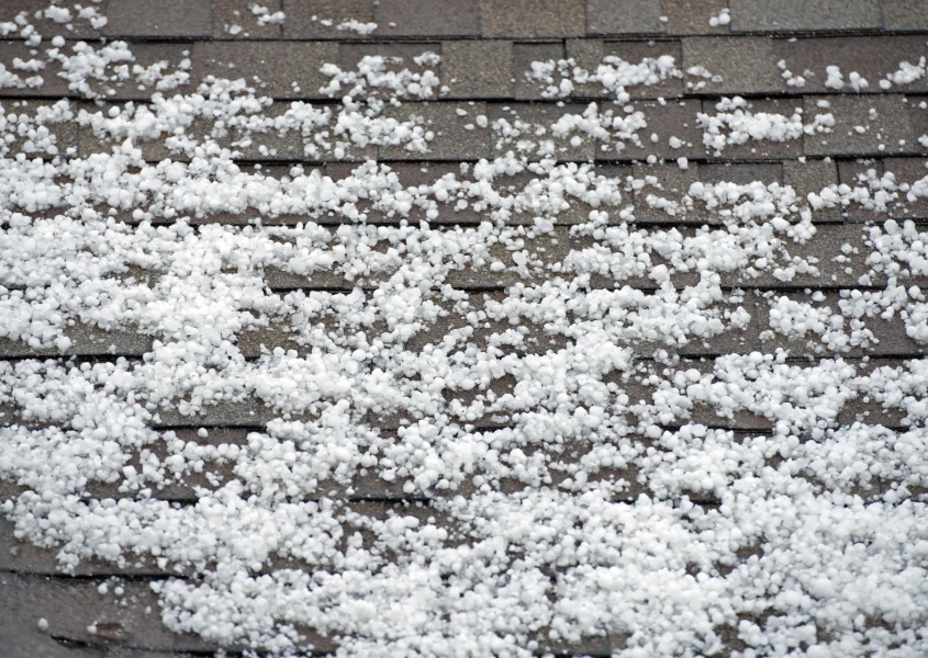 Hail damage roof repair needed on Madison home after severe storm in Dane County