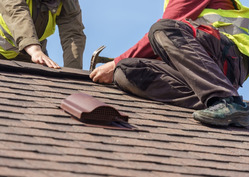 Same-day residential roof repair truck arriving at damaged home in Dane County