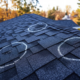 Local roofers with roof warranty coverage circling problem spots on roof