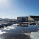 Commercial flat roof with standing water showing commercial roof liability risks