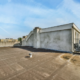 Commercial flat roof showing early signs of flat roof failure causes including membrane wear