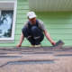 Homeowner attempting a DIY repair, illustrating common roofing mistakes homeowners make