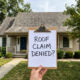 Homeowner reviewing a roofing contract to understand roof warranty exclusions